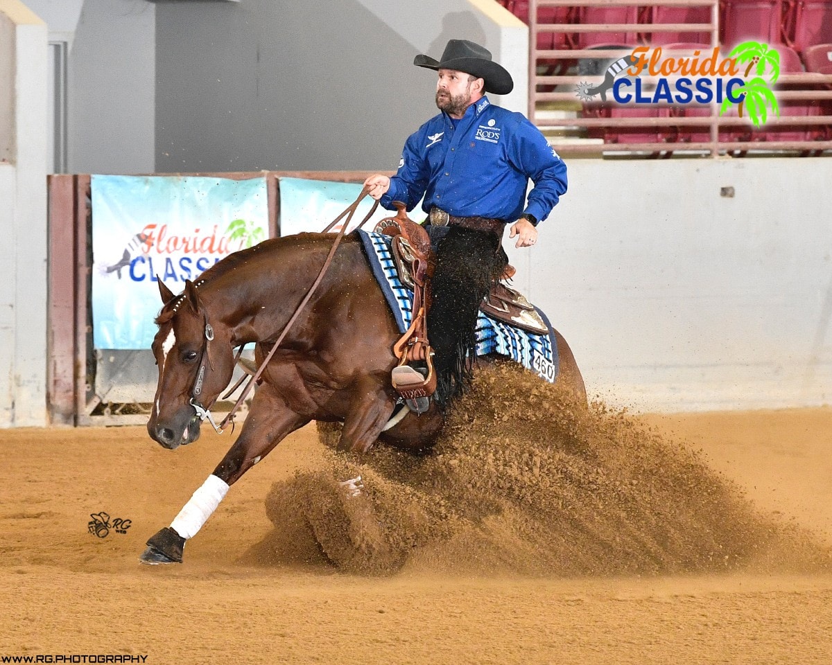 Robin Schoeller loping a chestnut horse at the All Star Reining Stakes